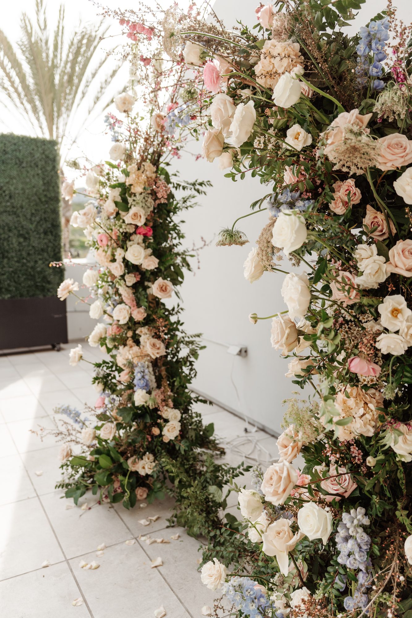 Pastel floral archway entrance with roses and hydrangea