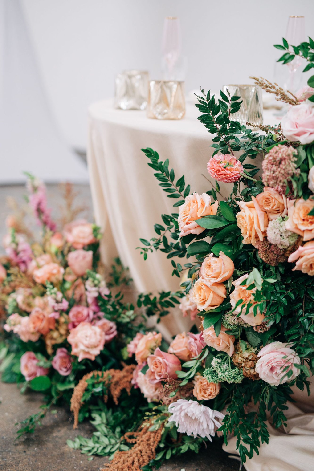 Peach and blush reception centerpiece with roses